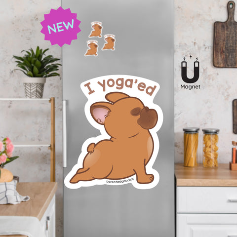 Product picture of a cute French Bulldog in a cobra pose fridge magnet with a background example of the Frenchie magnets clinging to a stainless steel fridge. French Bulldog magnet is designed by Bare It Designs.