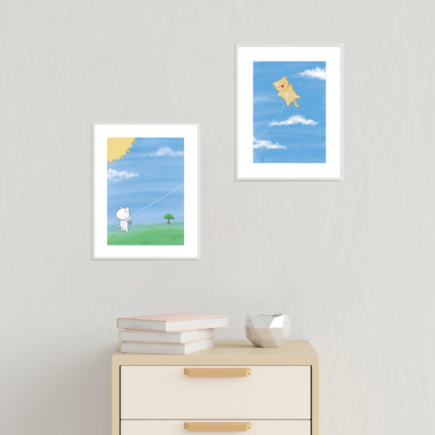 Demo of Bare It Designs' original art prints titled "Flying A Cat" on a wall.