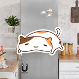 Product picture of a cute brown and orange patch plump lazy cat fridge magnet with a background example of the cat magnets clinging to a stainless steel fridge. This lazy cat magnet is designed by Bare It Designs, Edmonton, AB, Canada.