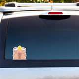 Peeker vinyl sticker/decal by Bare It Designs, Edmonton, AB, Canada. A demo of what the peeker sticker featuring a capybara with its hands together in a prayer pose, with a small yellow duckling on top of its head doing the same pose and the words Inner Peace looks like on the window of a vehicle.