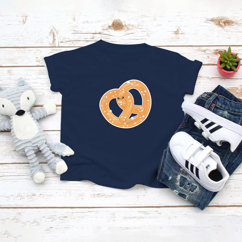 Navy toddler / kid t-shirt with a cute classic pretzel twist drawing in the kawaii art style. Designed and printed by Bare It Designs.