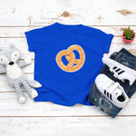 Royal blue toddler / kid t-shirt with a cute classic pretzel twist drawing in the kawaii art style. Designed and printed by Bare It Designs.