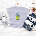 Grey toddler t-shirt with a cute avocado bubble tea drink drawing in the kawaii art style. Designed and printed by Bare It Designs.