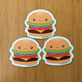  Cute kawaii cheeseburger fridge magnet designed by Bare It Designs from Edmonton, AB, Canada. Multiple cheeseburger magnets arranged in a triangle layout.
