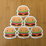  Cute kawaii cheeseburger fridge magnet designed by Bare It Designs from Edmonton, AB, Canada. Multiple cheeseburger magnets arranged in a pyramid layout.