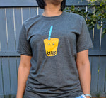 Model wearing a medium adult heather grey tshirt with a large bubble (boba) tea drink with a cute face designed and printed by Bare It Designs.