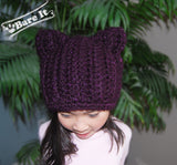 Model wearing the galaxy colored warm, chunky textured crochet/knit toque featuring cat (animal) ears. Handmade by Bare It Designs Ltd.