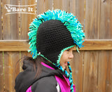 Model is wearing size M punk rocker character crochet toque with ear flaps and braided draw strings. Handmade by Bare It Designs Ltd.