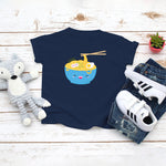 Navy toddler t-shirt with a cute happy ramen noodle bowl drawing in the kawaii art style. Designed and printed by Bare It Designs.