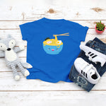 Royal blue toddler t-shirt with a cute happy ramen noodle bowl drawing in the kawaii art style. Designed and printed by Bare It Designs.