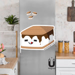 Product picture of a cute flexible s'more fridge magnet with a background example of fries magnets clinging to a stainless steel fridge. S'more magnet is designed by Bare It Designs.