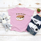 Light pink toddler t-shirt with a cute smore with melted chocolate and the saying "S'more To Love" drawing in the kawaii art style. Designed and printed by Bare It Designs.
