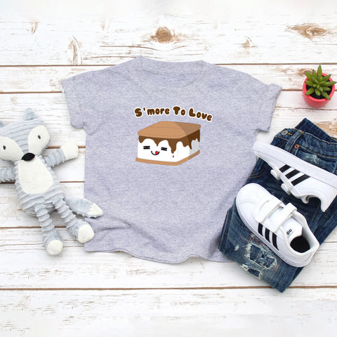 Grey toddler t-shirt with a cute smore with melted chocolate and the saying "S'more To Love" drawing in the kawaii art style. Designed and printed by Bare It Designs.