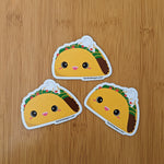 Cute kawaii taco fridge magnet designed by Bare It Designs from Edmonton, AB, Canada.  Multiple taco magnets arranged in a pyramid scheme.