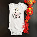 Kawaii cute baby cow with the saying Too Cute To Be Moo-dy for the 2021 Year of the Ox graphic on a baby bodysuit designed and printed by Bare It Designs.